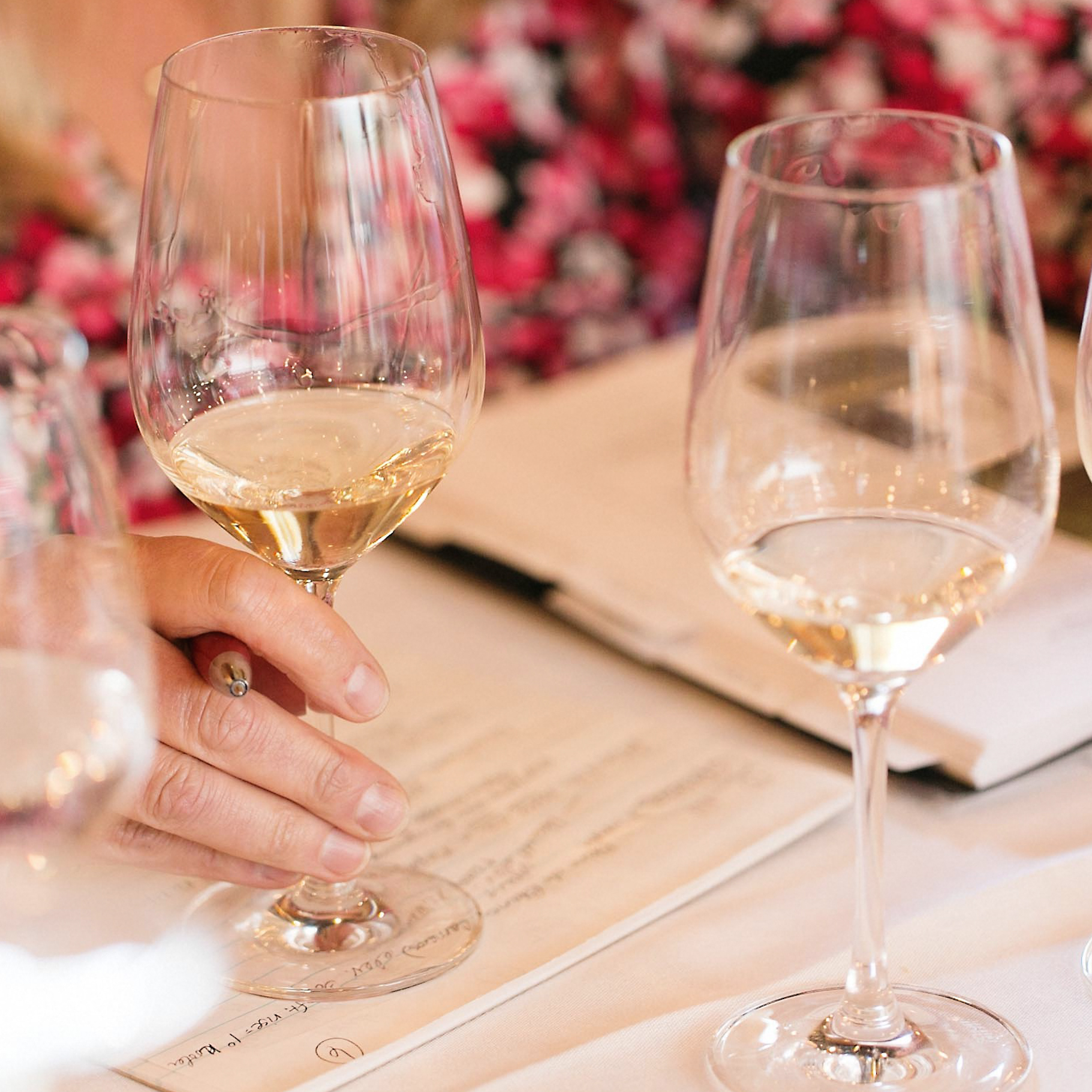 Glasses of aromatic white wines prepared for tasting in the Blind Tasting: Aromatic White Wines class at San Francisco Wine School.